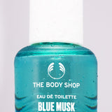 Close up shot of a bottle of Blue Musk Zest Eau de Toilette by The Body Shop