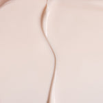 Close-up of The Body Shop Vitamin E Day cream with a subtle gradient.