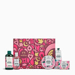 Collection of The Body Shop British Rose products with a pink and yellow patterned box on a white background.